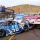 Johnson’s battle-worn car comes in on a wrecker at Phoenix International Raceway. Photo credit: Getty Images